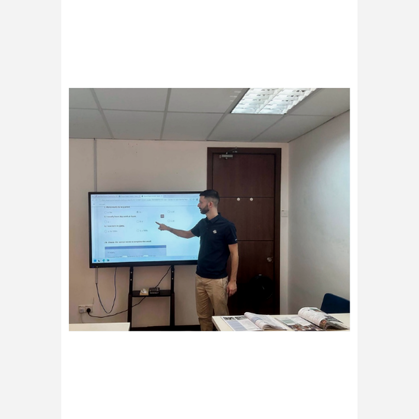 Teacher Chris leading an interactive English lesson